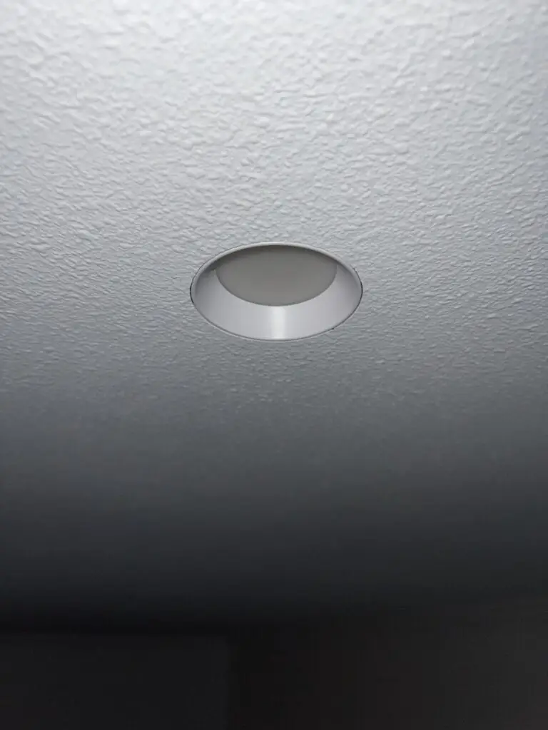 Recessed ceiling light installed in a textured ceiling